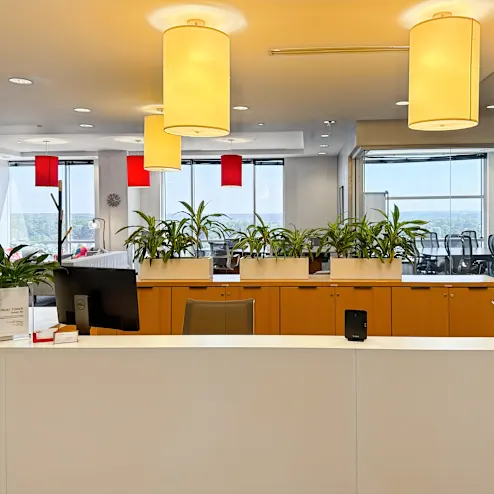 Bright reception area with seating and windows at the Kurtz and Blum North Hills office